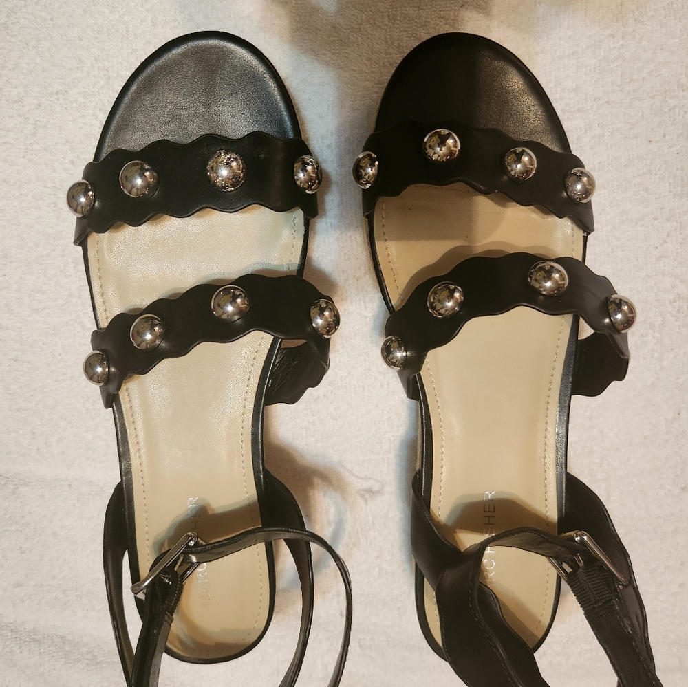 Size 11 black ankle & double strapped 2 inch heel leather sandal.